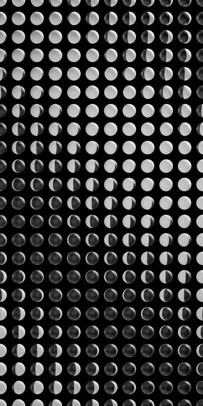 Black-and-white balls form a shifting pattern.