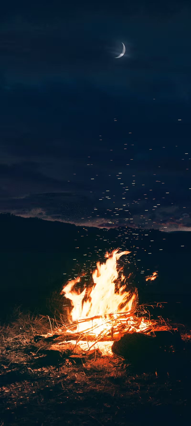 Bonfire emitting sparks.