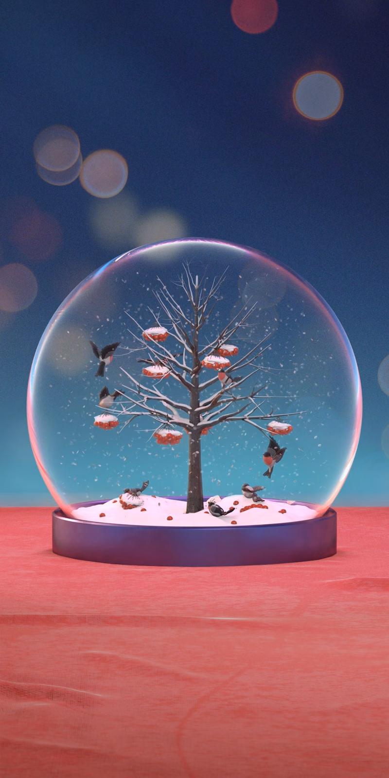 Bullfinches perch beside rowan berries inside a Christmas snow globe.