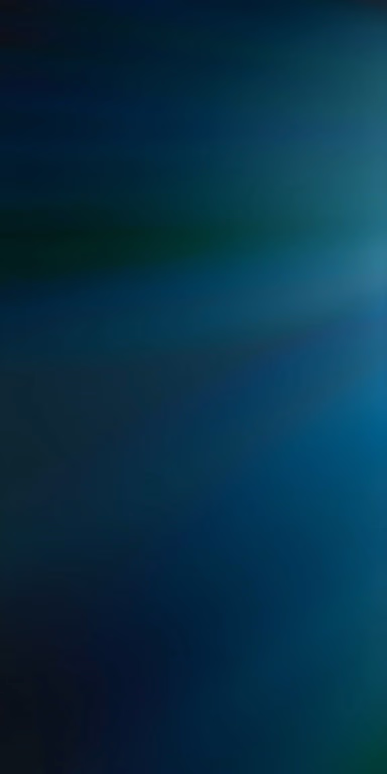 Blue-green light caustics shimmer across a dark surface.