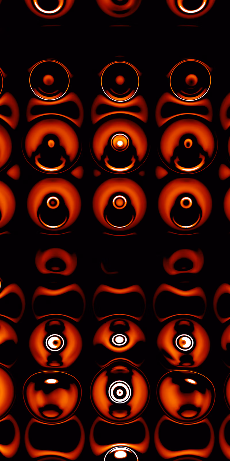 Small red circles glow against a black background.
