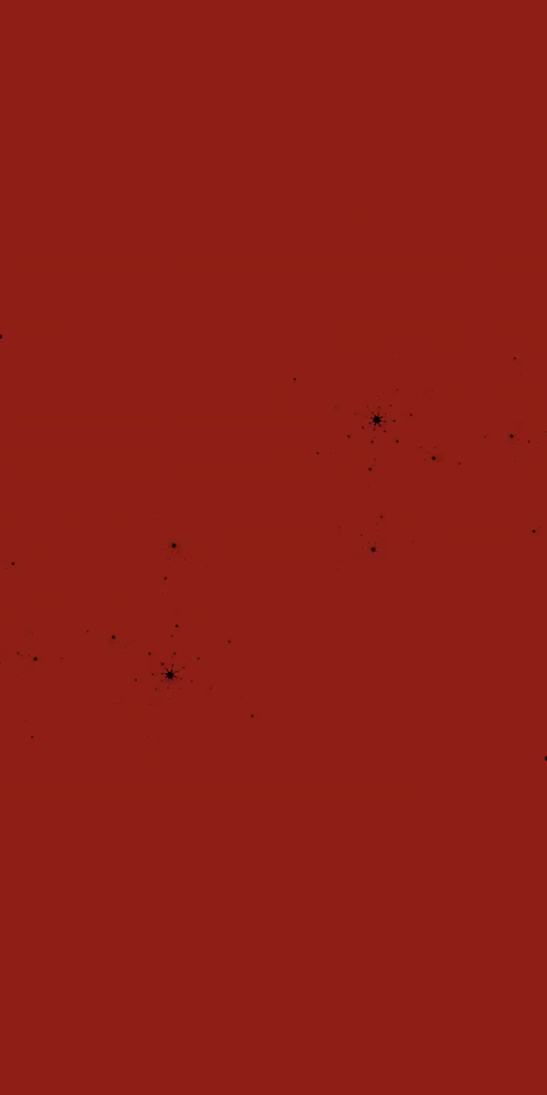 A black-and-red Mandelbrot fractal unfolds in a seamless loop.
