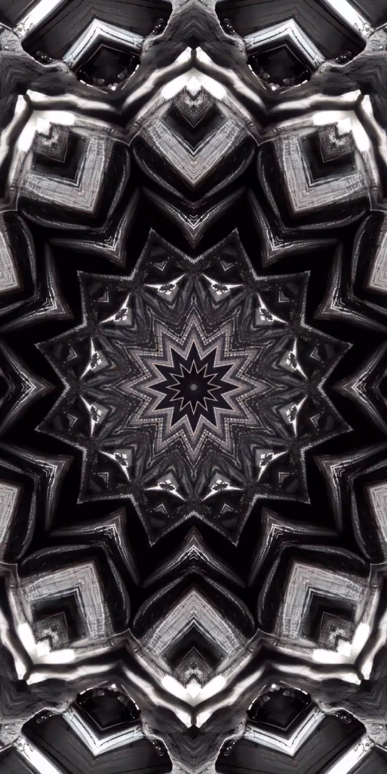 Black, gray and white colors glitter in the kaleidoscope.