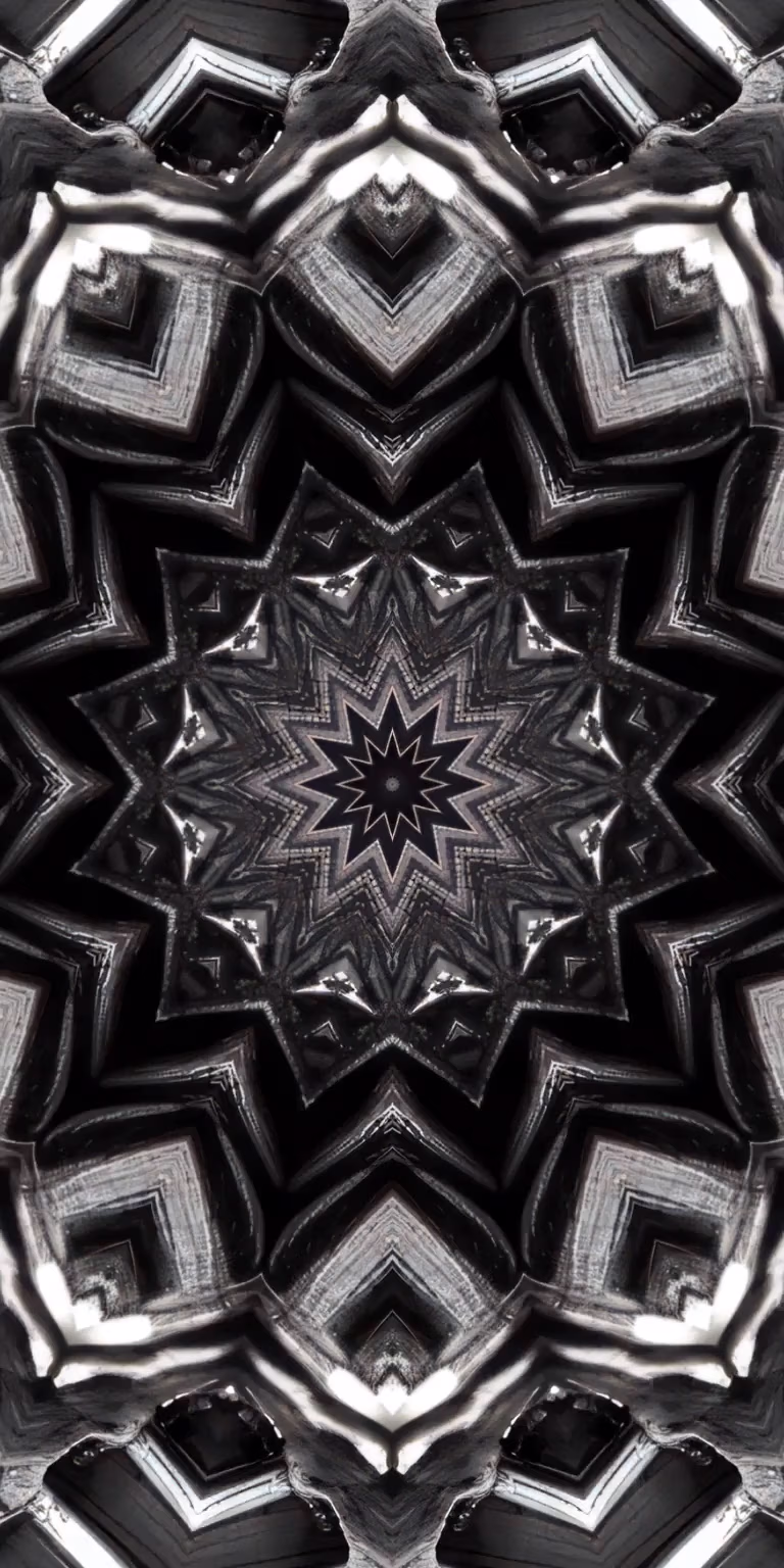Black, gray and white colors glitter in the kaleidoscope.