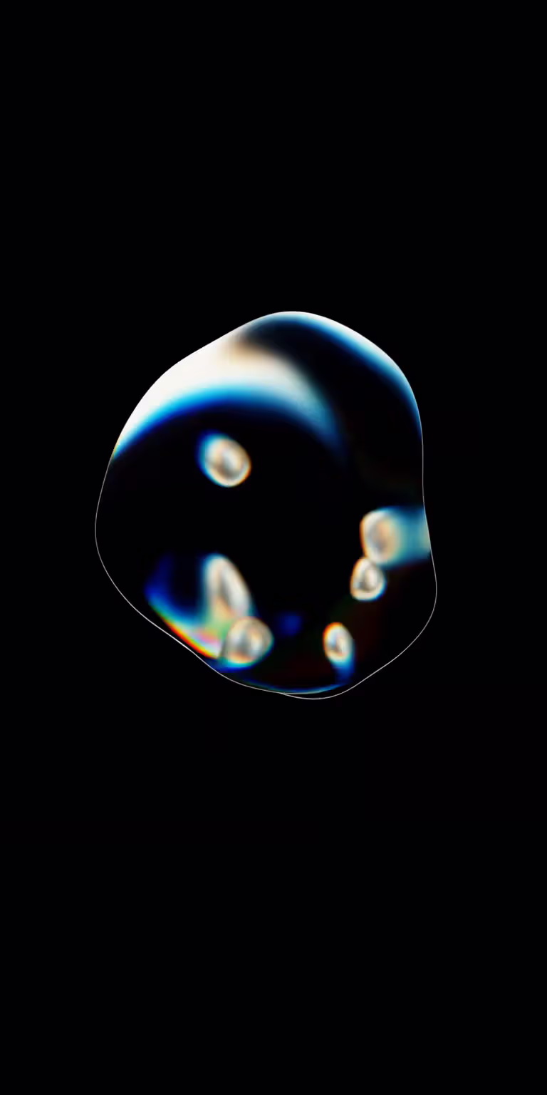 A translucent liquid bubble flows and changes shape.