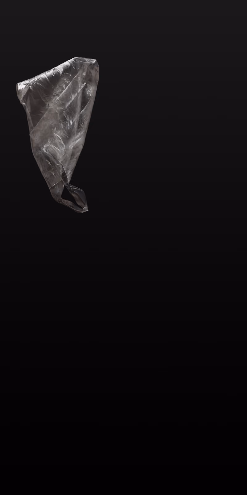 A translucent plastic bag floats and twists in the air.