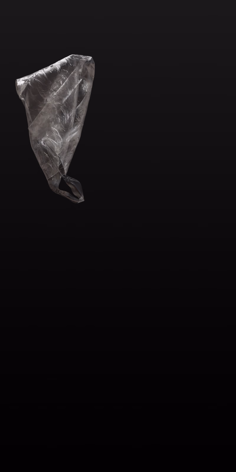 A translucent plastic bag floats and twists in the air.