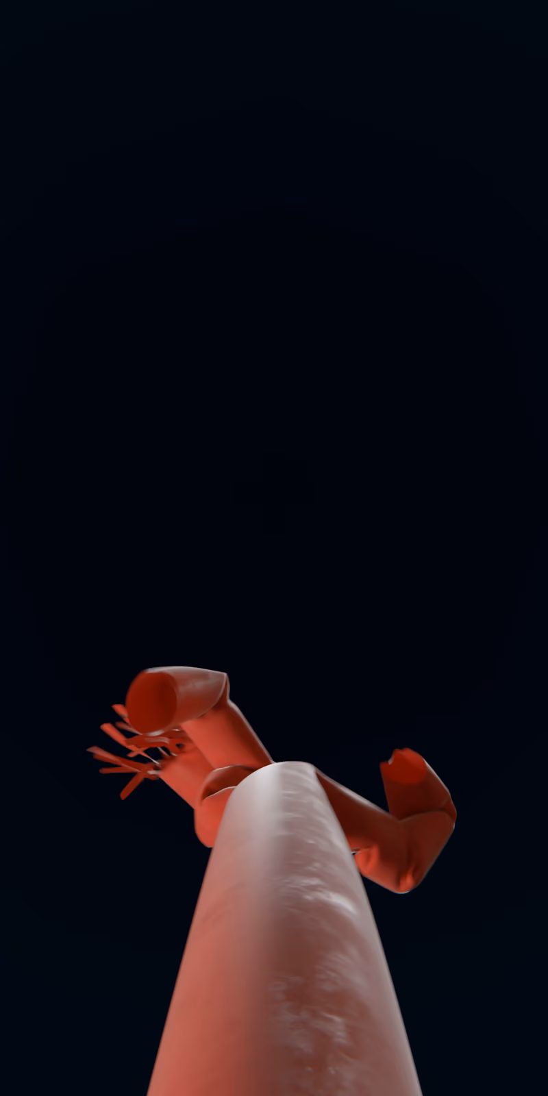 An inflatable red skydancer sways against a black background.