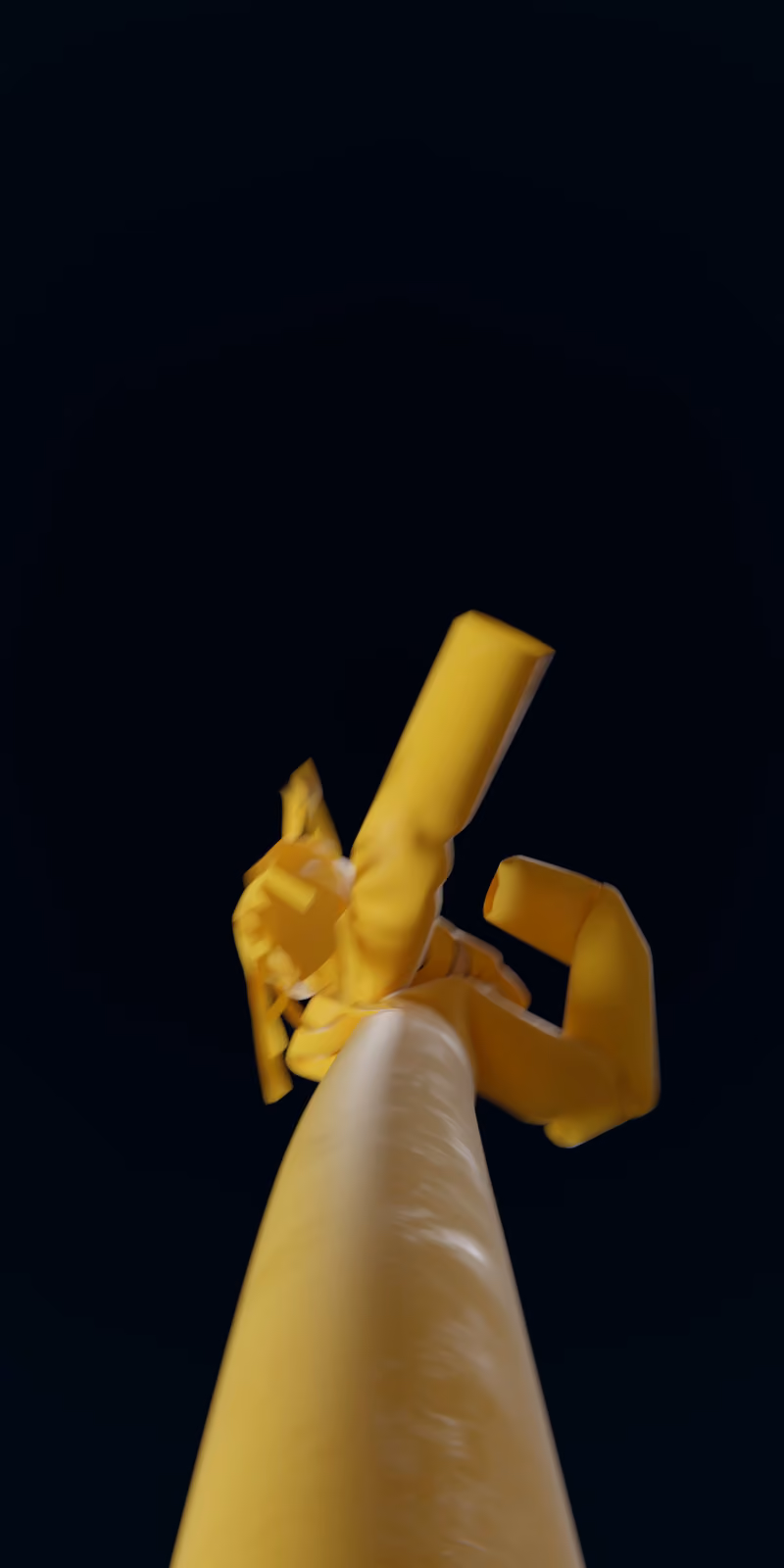 An inflatable yellow skydancer sways against a black background.